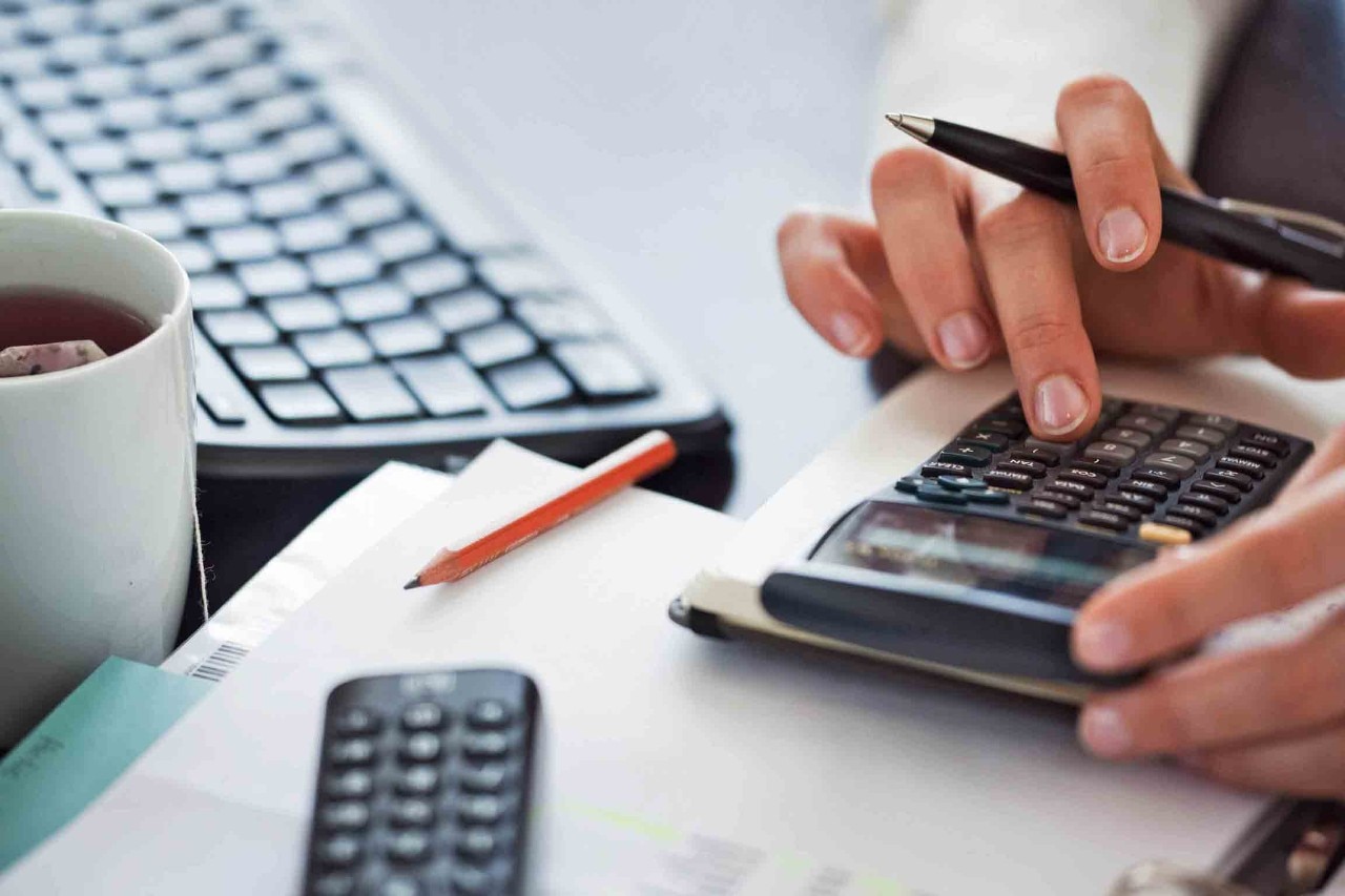 141445069 Woman hand using calculator